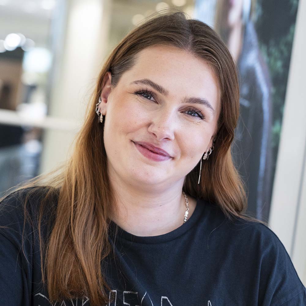 Smilende medarbejder fra SlotsArkaderne